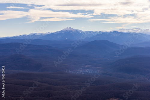 Winter morning sunrise in the mountains panoramic view from the site located on the ridge of the tourist route.