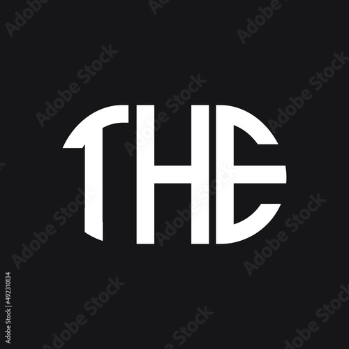 THE letter logo design on black background. THE creative initials letter logo concept. THE letter design.

 photo