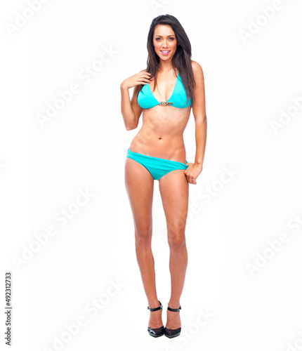 Happy sexy woman standing in blue bikini isolated on white backg. Happy young sexy woman standing in blue bikini isolated on white background.