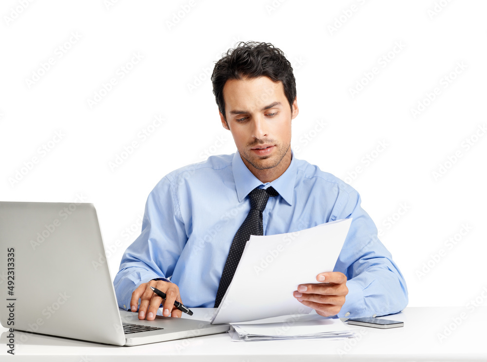 Diligence always pays off in the workplace. Studio shot of a handsome businessman working on his laptop. Diligence always pays off in the workplace. Studio shot of a handsome businessman working on his laptop.