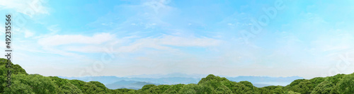 山と水色の空と真っ白な雲 背景素材 横長パノラマ