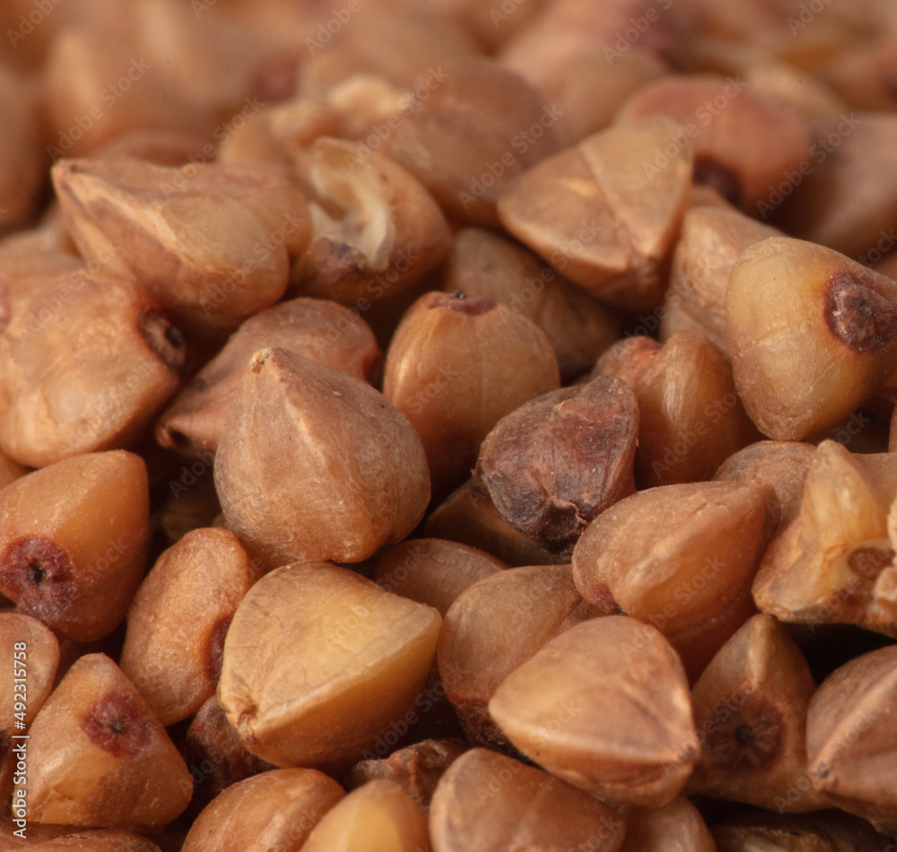 Close-up of buckwheat groats as background. Close-up of buckwheat groats as background.