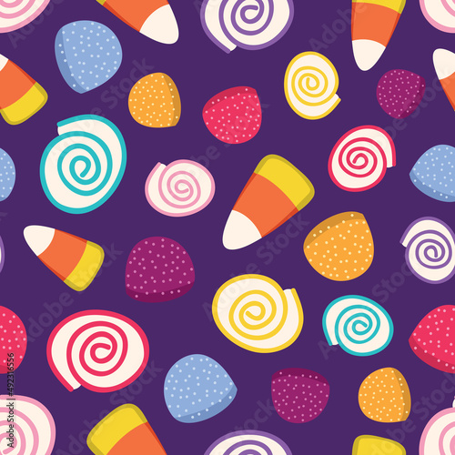 Colorful Candies seamless pattern design, purple background © Elinnet