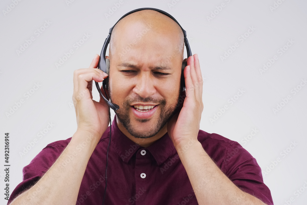 Efficient response is what great customer relationships are built on. Studio shot of a handsome young male customer service representative wearing a headset against a grey background. Efficient response is what great customer relationships are built on. Studio shot of a handsome young male customer service representative wearing a headset against a grey background.