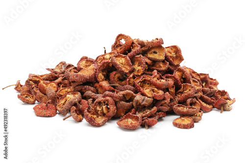 Dried hawthorn slices for brewing tea on white background photo