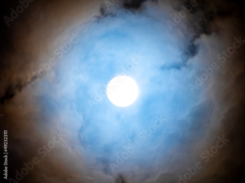 Moon Shines Softly White Light Through The Clouds
