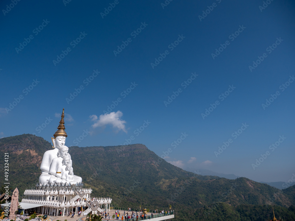 5 White Buddha Statues Sitting on The Hill