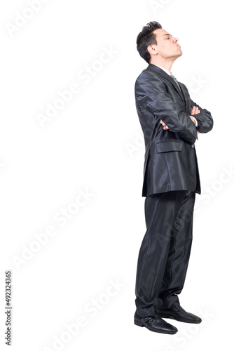 Dissatisfied businessman in suit in studio. White background.