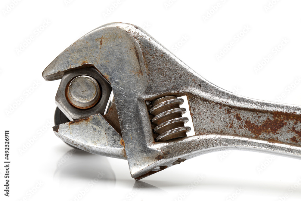 Wrench and bolt closeup on white background Wrench and bolt closeup on white background