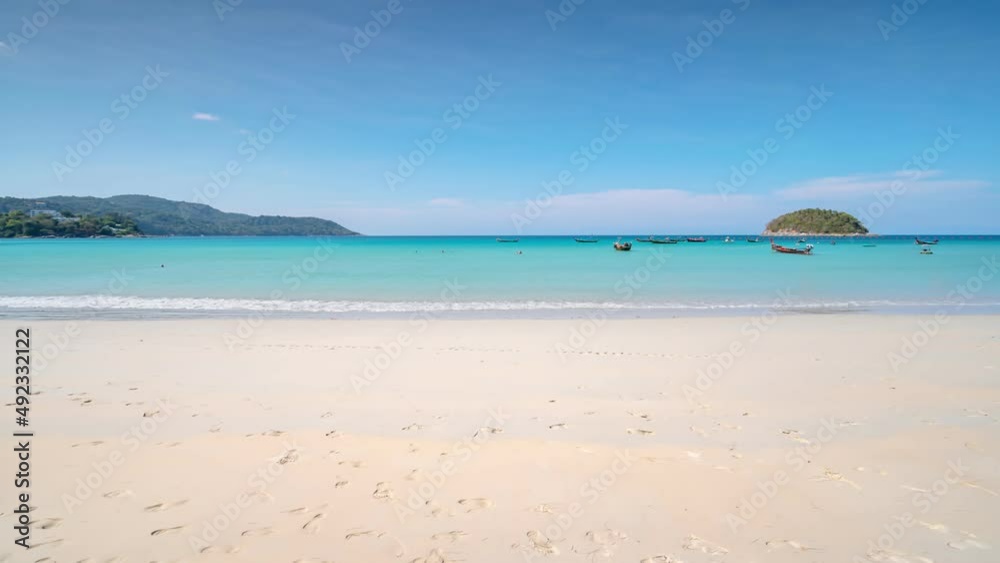 Phuket Thailand beach.Blue sky Timelapse clouds background Clear blue Sky with cloudy in good weather day Summer sunny day with wave crashing on beach White clouds floating in sky Amazing sea sand Phuket Thailand beach.Blue sky Timelapse clouds background Clear blue Sky with cloudy in good weather day Summer sunny day with wave crashing on beach White clouds floating in sky Amazing sea sand