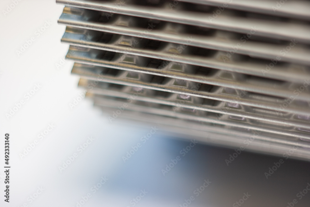 shiny metal corrugation. bent aluminum foil lamella. shiny metal corrugation. bent aluminum foil lamella.