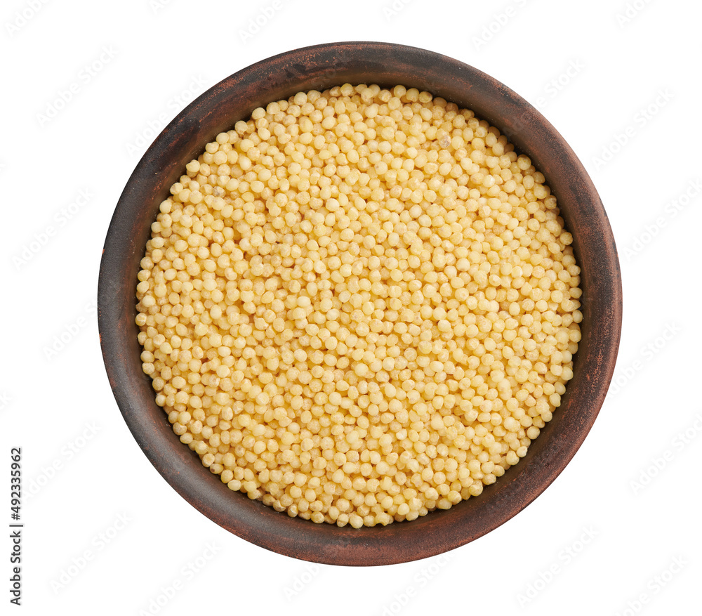 Dry millet in clay bowl isolated on white. Top view Dry millet in clay bowl isolated on white. Top view