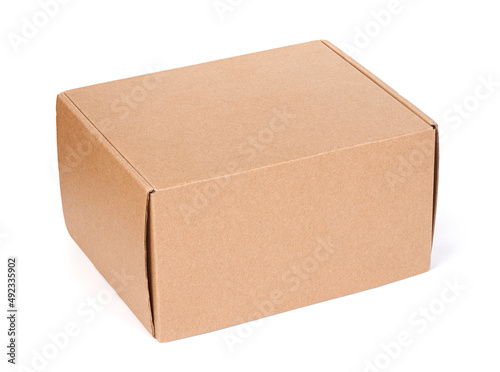 Brown cardboard box isolated on a white background © spaxiax