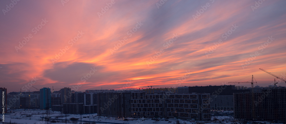 sunset over a construction site in the city sunset over a construction site in the city