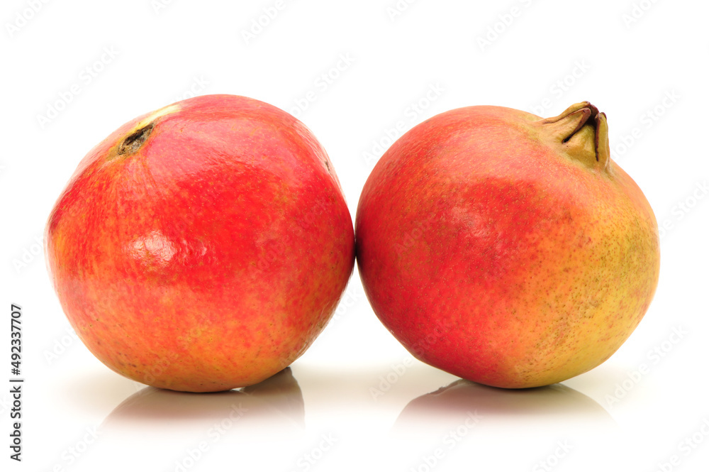 Ripe pomegranate fruit isolated on white background
