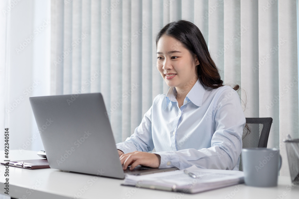 Businesswoman using laptop for financial and accounting work, Using computers to conduct financial transactions because the convenience, Freelancers work, Online communication, Internet, Wireless. Businesswoman using laptop for financial and accounting work, Using computers to conduct financial transactions because the convenience, Freelancers work, Online communication, Internet, Wireless.