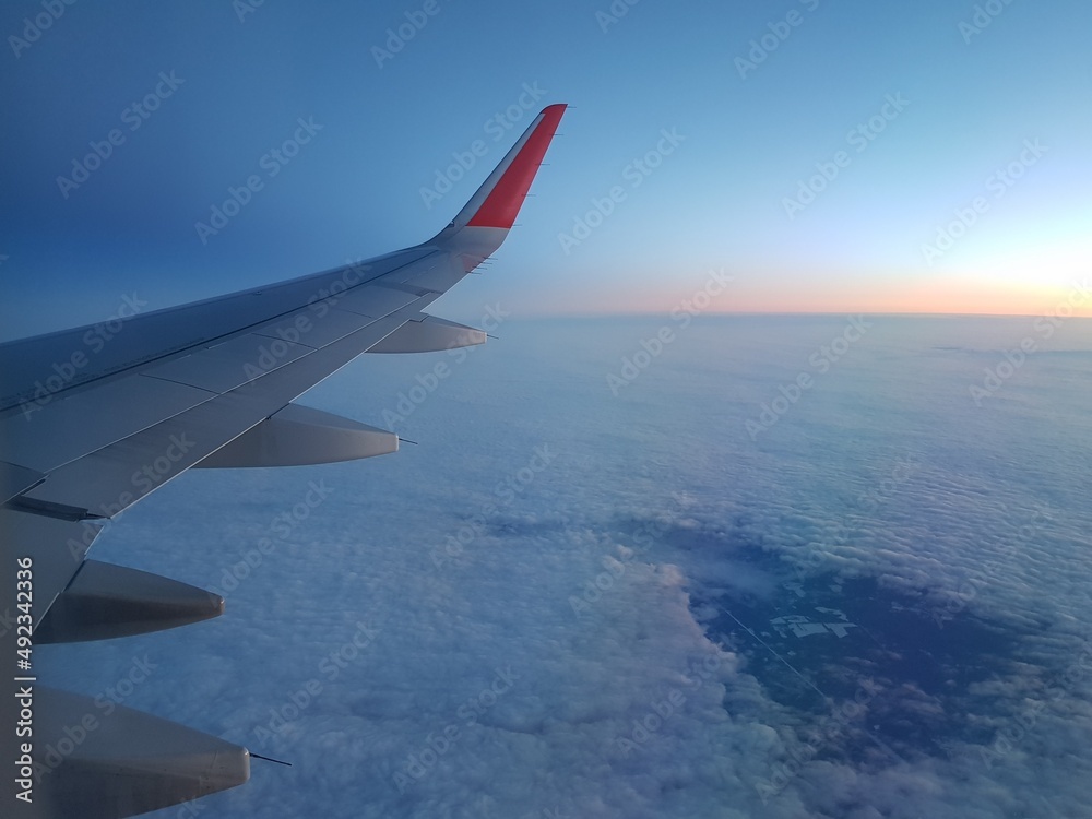 Wing of an airplane in the morning sky