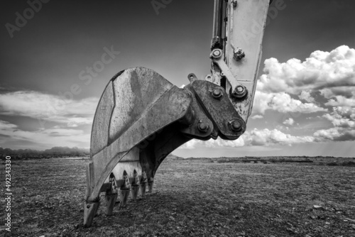 Industrial background. Digger bucket close-up. Construction excavator bucket.