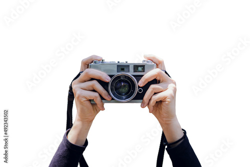 Digital camera in female hand isolated on white background.