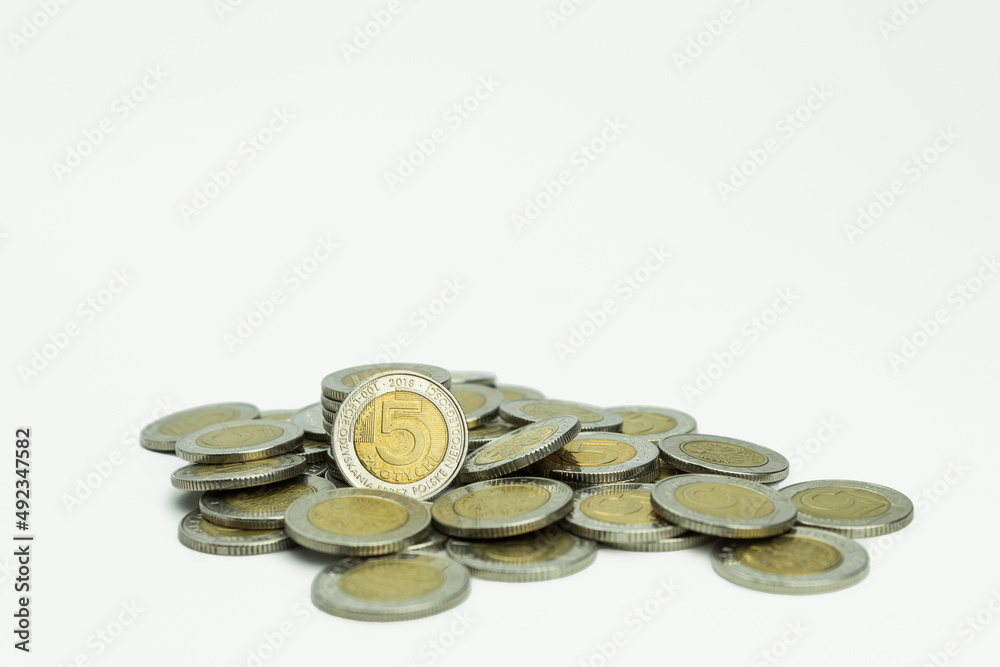 Pile of coins of different denominations on a white background Pile of coins of different denominations on a white background
