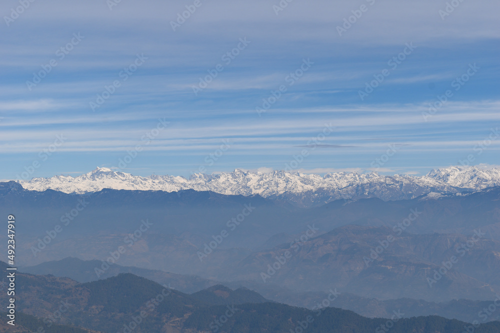 Himachal himalayan range telephoto capture. Indrasan peak in district kullu on left. Picture taken from Naina devi temple rewalsar