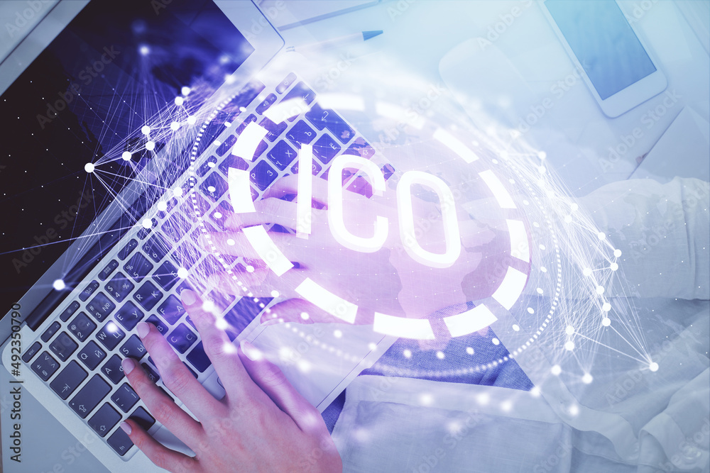 Double exposure of woman hands working on computer and blockchain theme hologram drawing. Top View. bitcoin cryptocurrency concept.