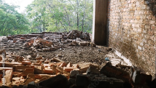 Close-up of the rubble of an industrial building collapsing into a pile of concrete and brick. and the jagged debris caused by the failure of the engineers at the abandoned construction.