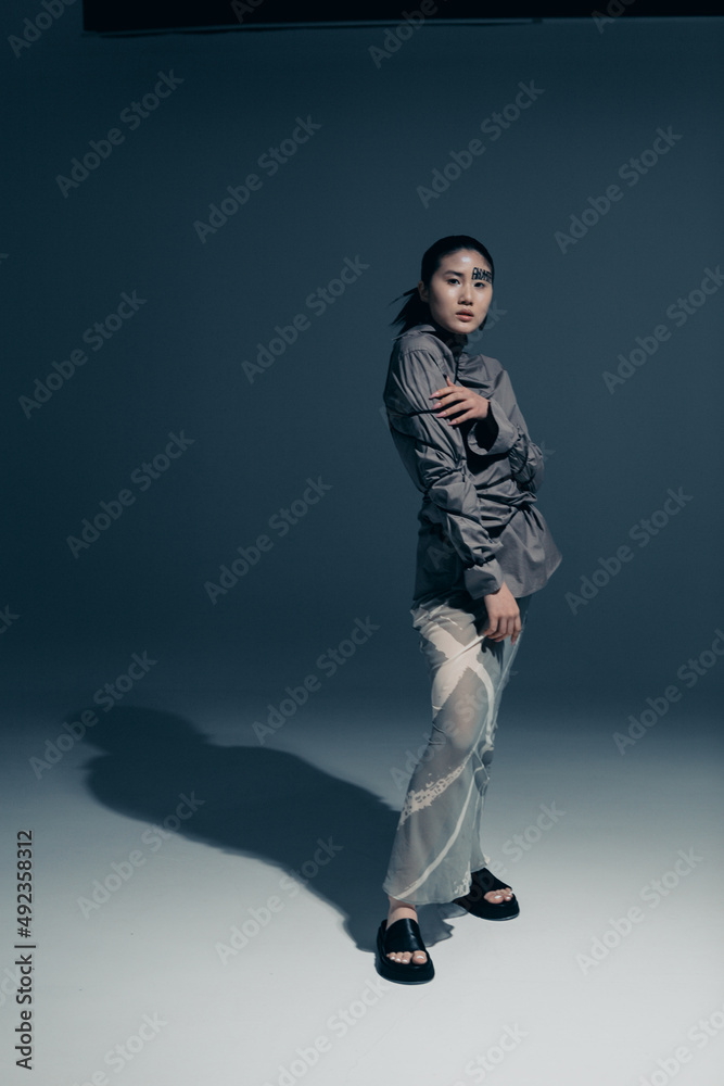 Art fashion portrait of a girl with Asian appearance in the studio Art fashion portrait of a girl with Asian appearance in the studio