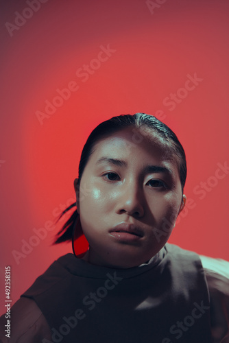 Art fashion portrait of a girl with Asian appearance in the studio 