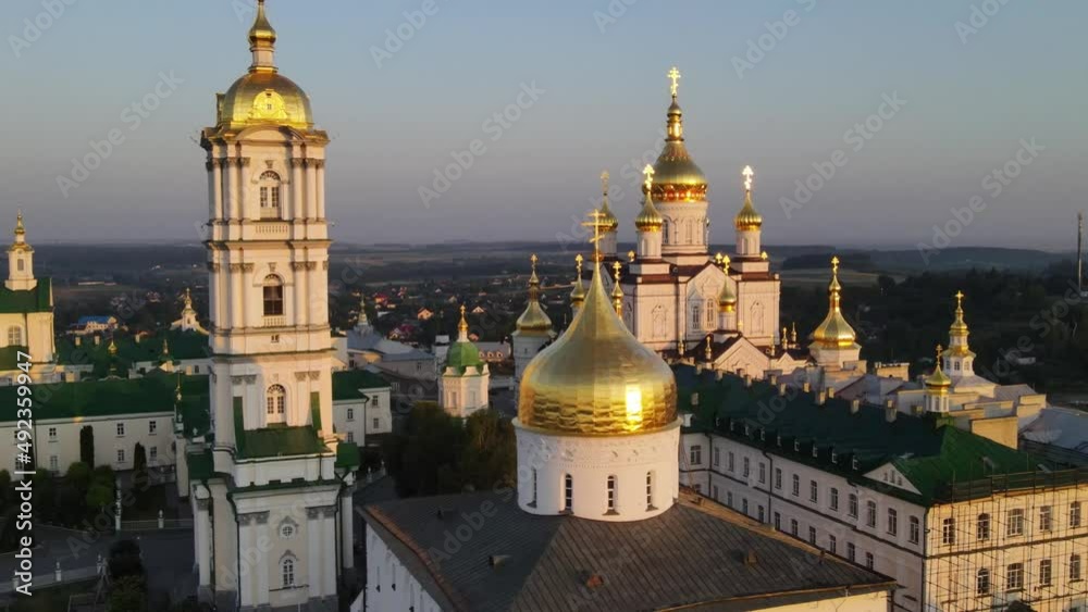 aerial view of orthodox cathedral in Ukraine, national religious symbol of Ukrainian identity, Pochaev monastery at sunrise aerial view of orthodox cathedral in Ukraine, national religious symbol of Ukrainian identity, Pochaev monastery at sunrise
