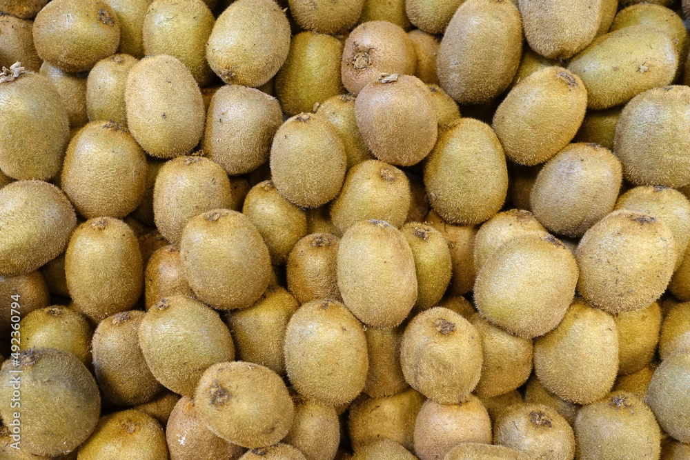 Fresh kiwi fruit in the greengrocer department, kiwi fruit on sale, lots of kiwi fruit, Fresh kiwi fruit in the greengrocer department, kiwi fruit on sale, lots of kiwi fruit,