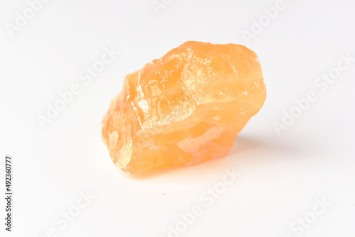 corundum stone  on a white background. yellow.