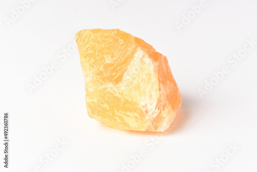corundum stone  on a white background. yellow.