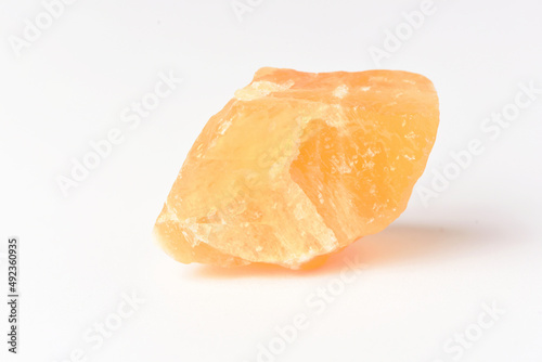 corundum stone  on a white background. yellow.