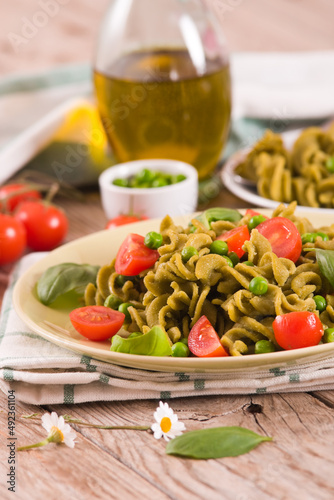 Fusilli pasta with cherry tomatoes and peas. 