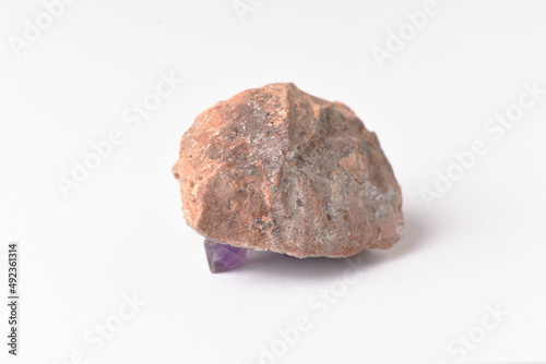 amethyst crystal grown on another stone ,marble, granite,