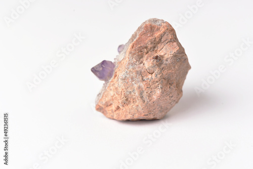 amethyst crystal grown on another stone ,marble, granite,