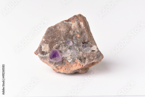 amethyst crystal grown on another stone ,marble, granite,