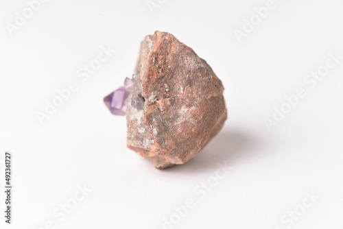 amethyst crystal grown on another stone ,marble, granite,