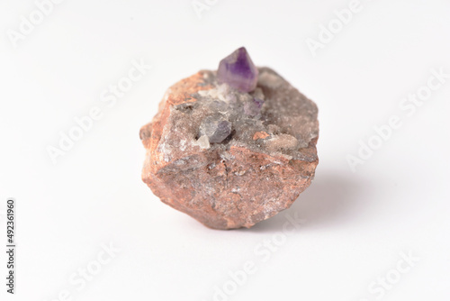 amethyst crystal grown on another stone ,marble, granite,
