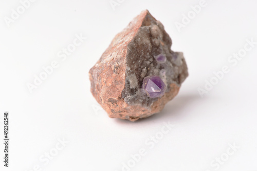 amethyst crystal grown on another stone ,marble, granite,