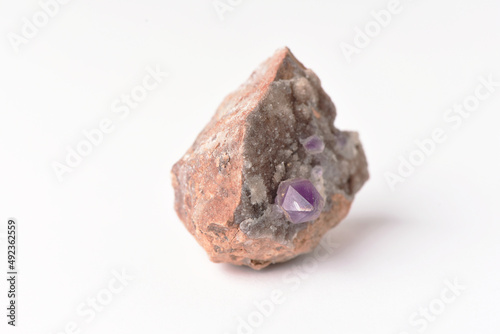 amethyst crystal grown on another stone ,marble, granite,