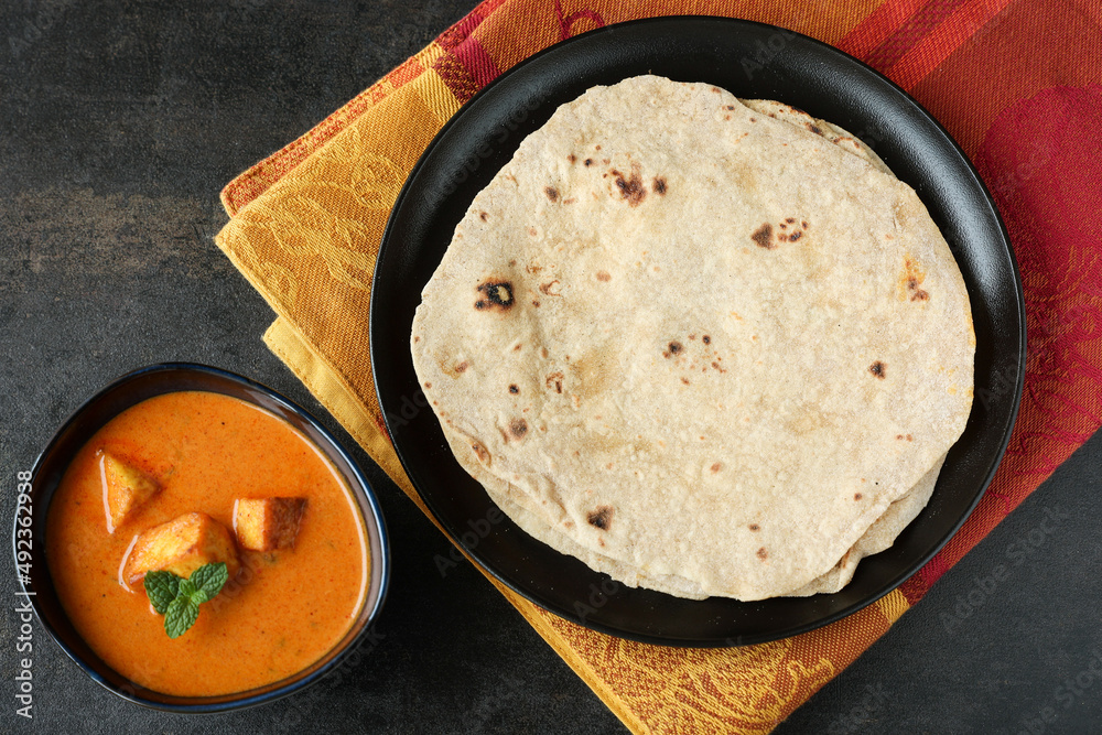 Tandoori Roti whole wheat flat bread with Indian curry butter chicken ...