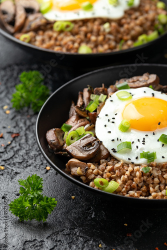 Bowl of Buckwheat with mushrooms, onion and egg. Healthy food
