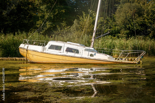 Small yacht wreck at the shore