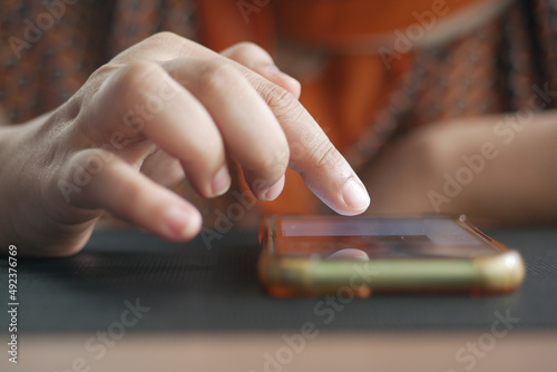 close up of women hand holding smart phone 