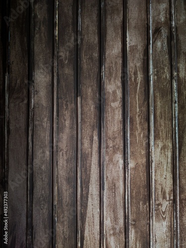wooden brown planks with shiny surface, texture.