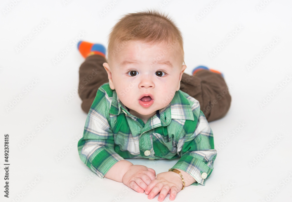 toddler posing on a white background. shocked face toddler posing on a white background. shocked face