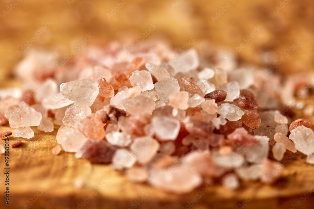 Himalayan pink salt crystals on wooden board Himalayan pink salt crystals on wooden board