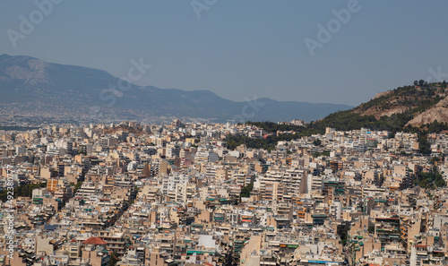 Top view of the city and mountains in summer in haze from the heat, Greece #492380777